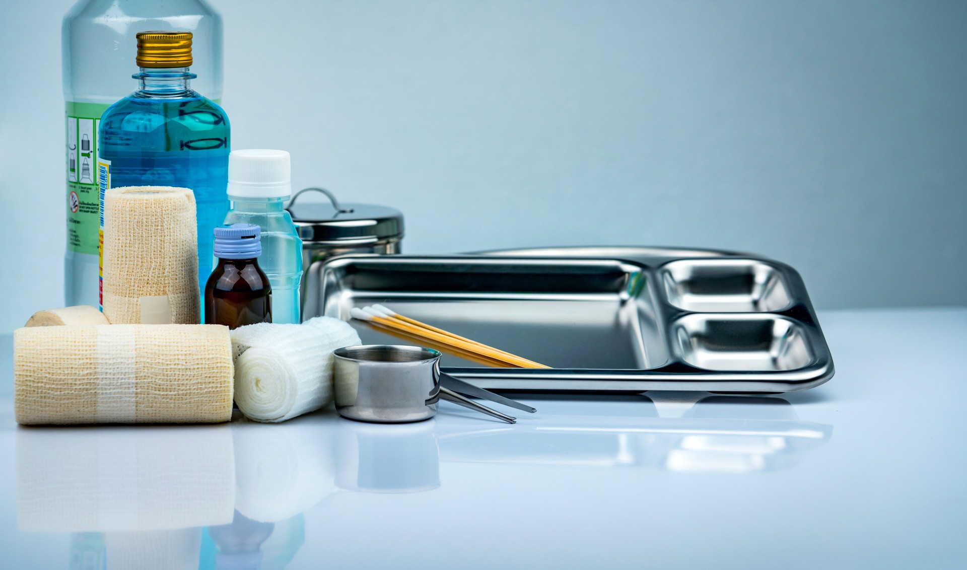 Wound care dressing set and stainless steel plate, forceps, iodine cup, conform bandage, elastic cohesive retention bandage, antiseptic and normal saline bottle, instruments container. Medical supply.